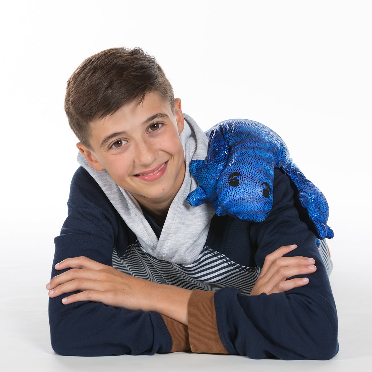 Blue weighted lizard plush draped over a teenager's shoulders, offering comfort and sensory support.