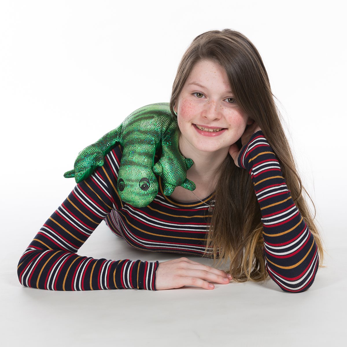 Teenager with a manimo green weighted lizard plush draped over their shoulders, providing sensory support.