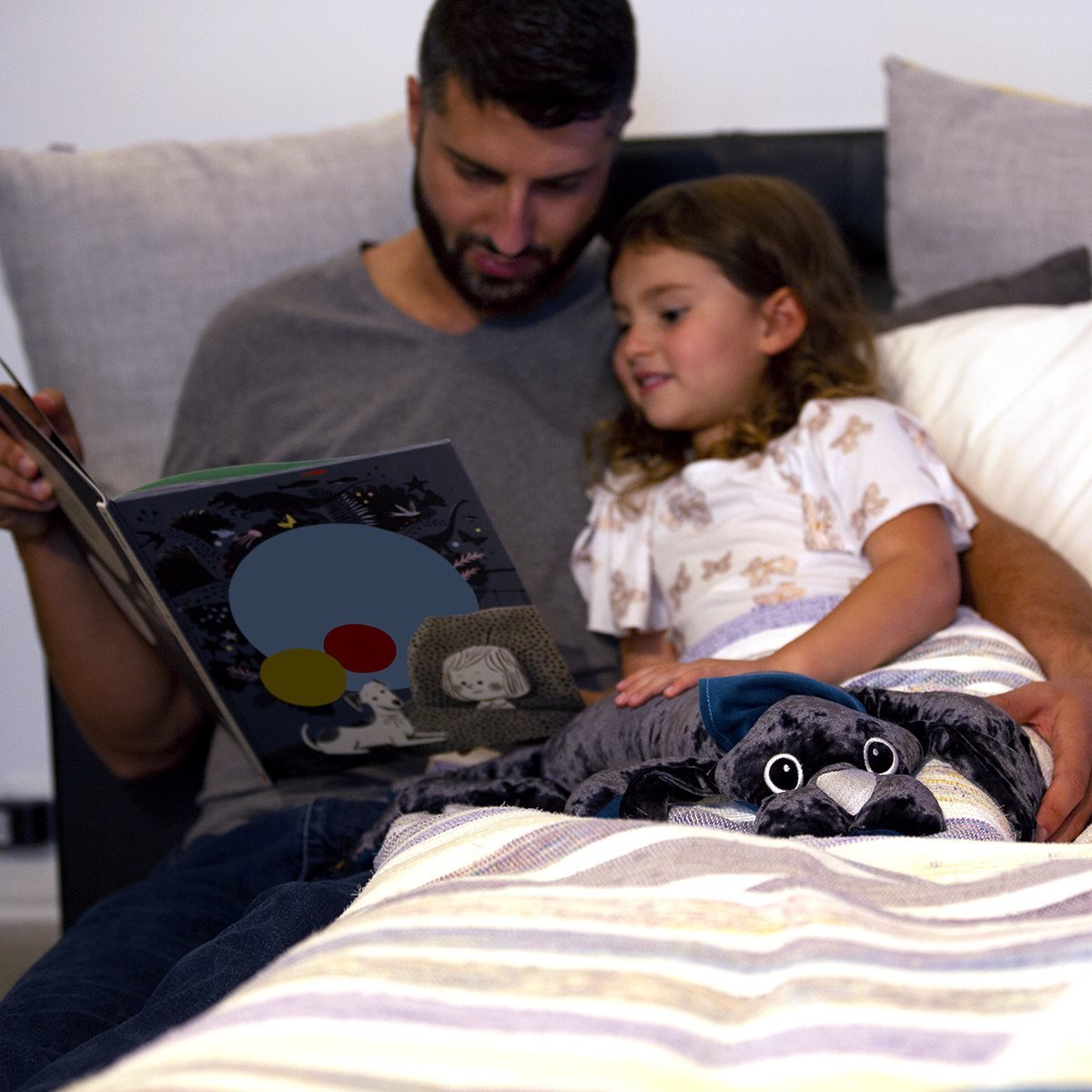 Child getting ready for bed with a 2 kg manimo dog plush, showing how the plush provides comfort and helps with sleep.